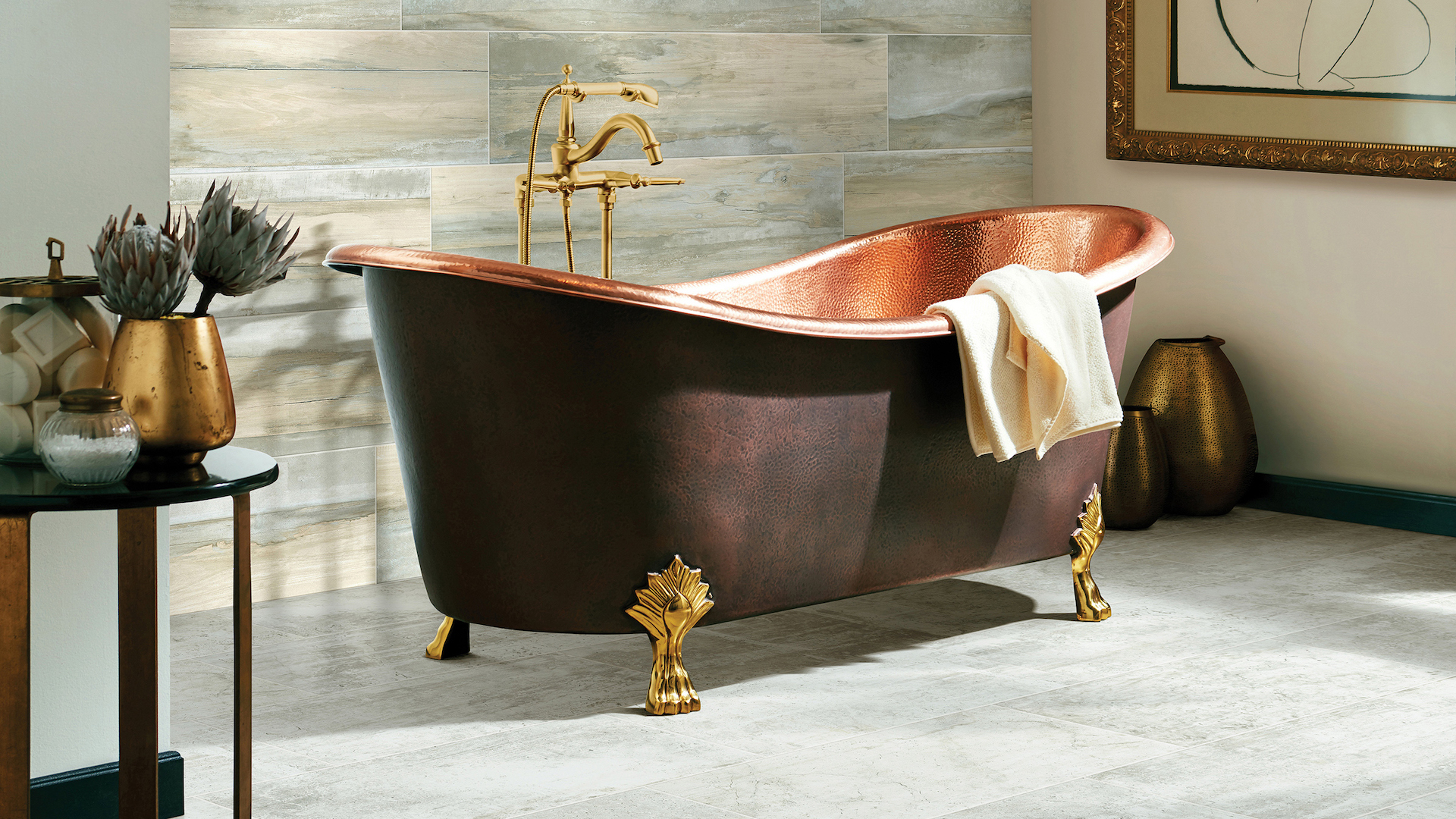 grey tile flooring and wood look tile walls in a stylish bathroom with a stand alone copper tub